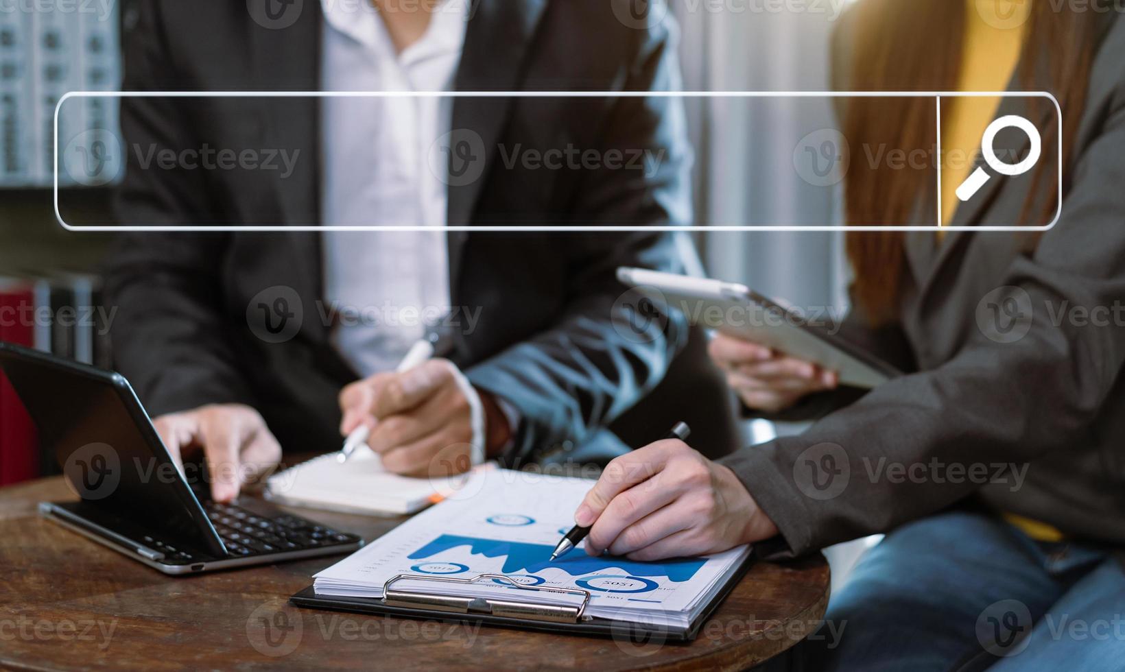 Searching Browsing Internet Data Information Networking Concept with blank search bar.businessman working with mobile phone and laptop computer VR icon in office photo