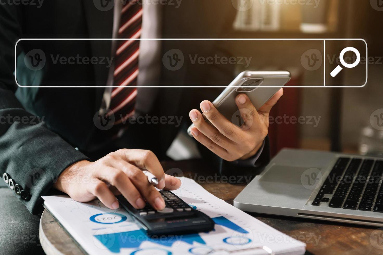 Searching Browsing Internet Data Information Networking Concept with blank search bar.businessman working with mobile phone and laptop computer VR icon photo