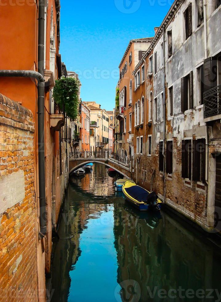 Beautiful view of the bridge over venetian canal photo