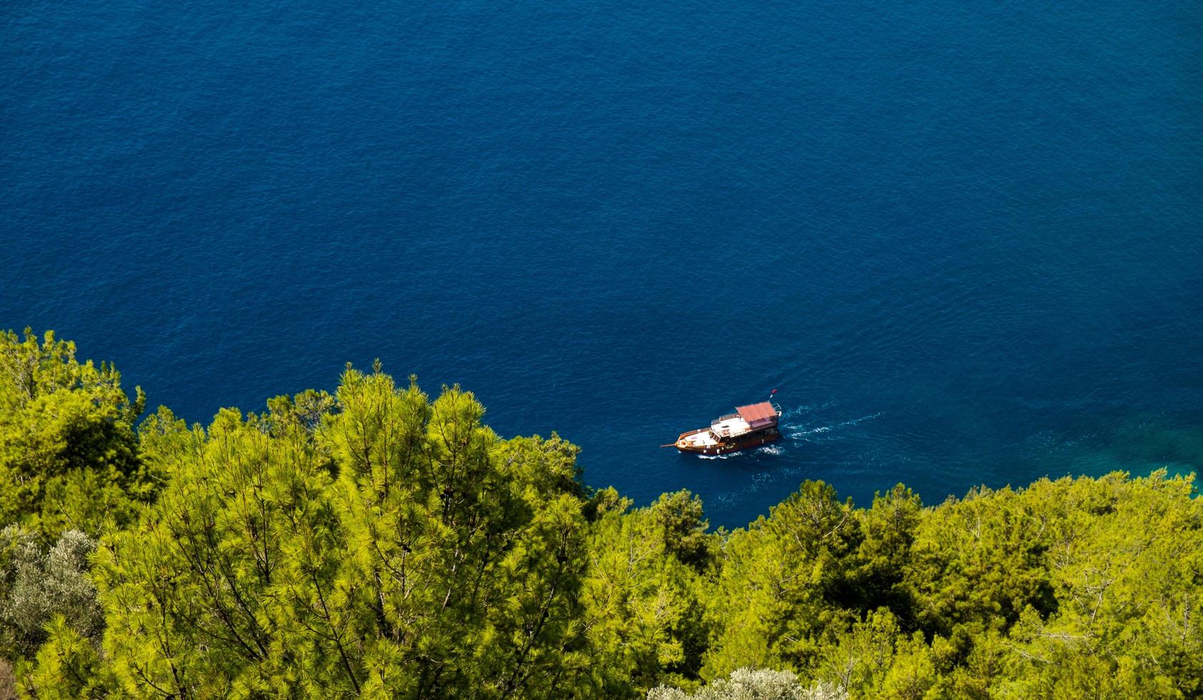 Ferry boat on sea background - blue ocean water in calm and boat tours travel photo