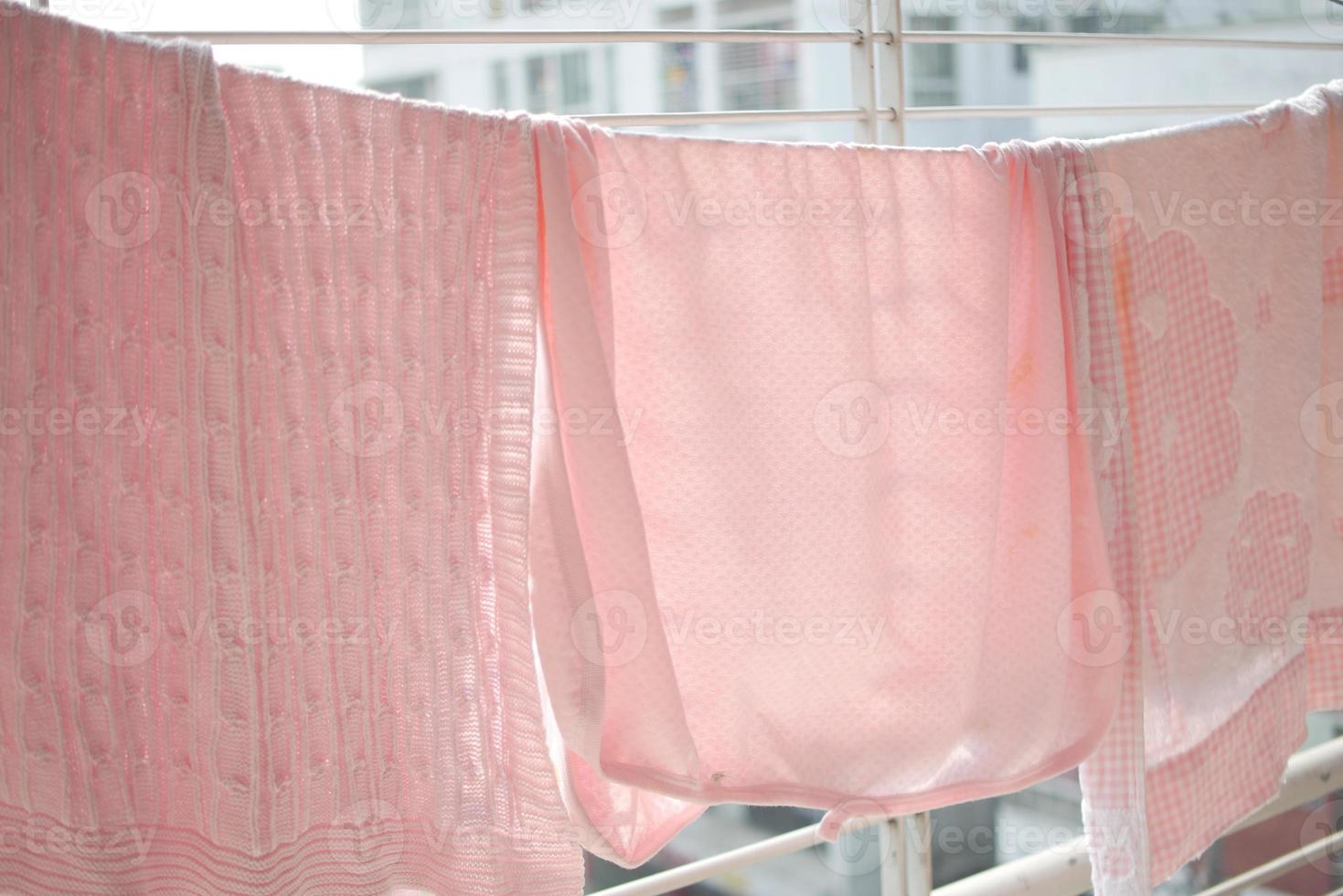 child clothes line filled with hanging trousers photo