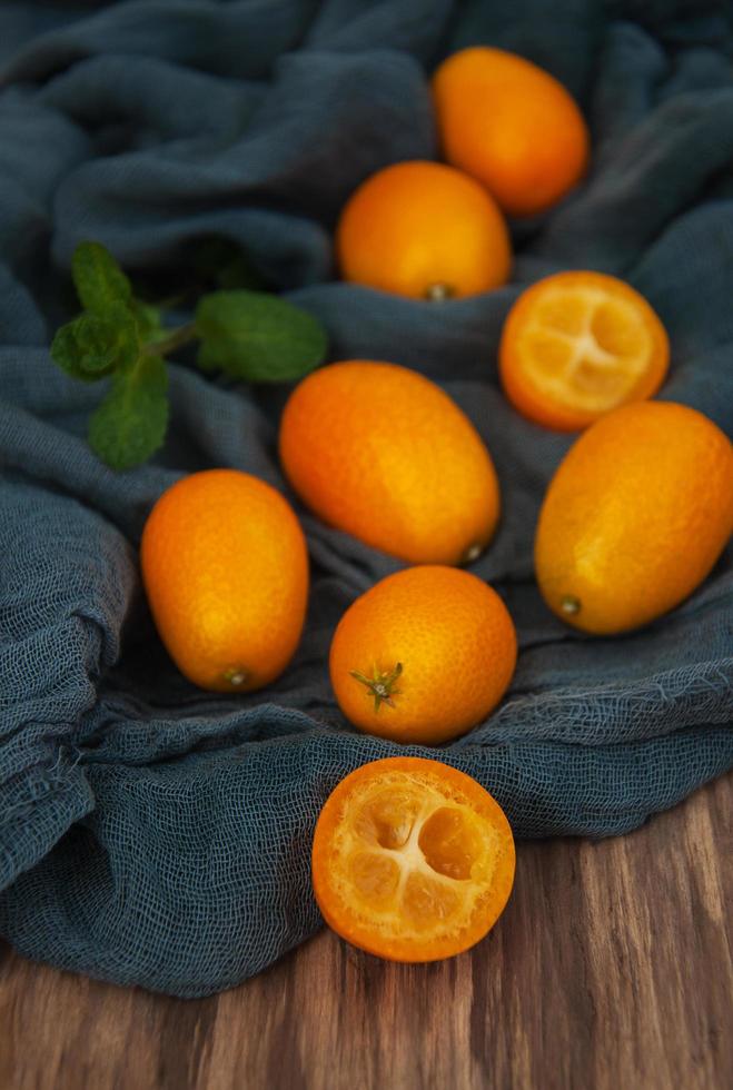 Kumquats on a textile napkins photo