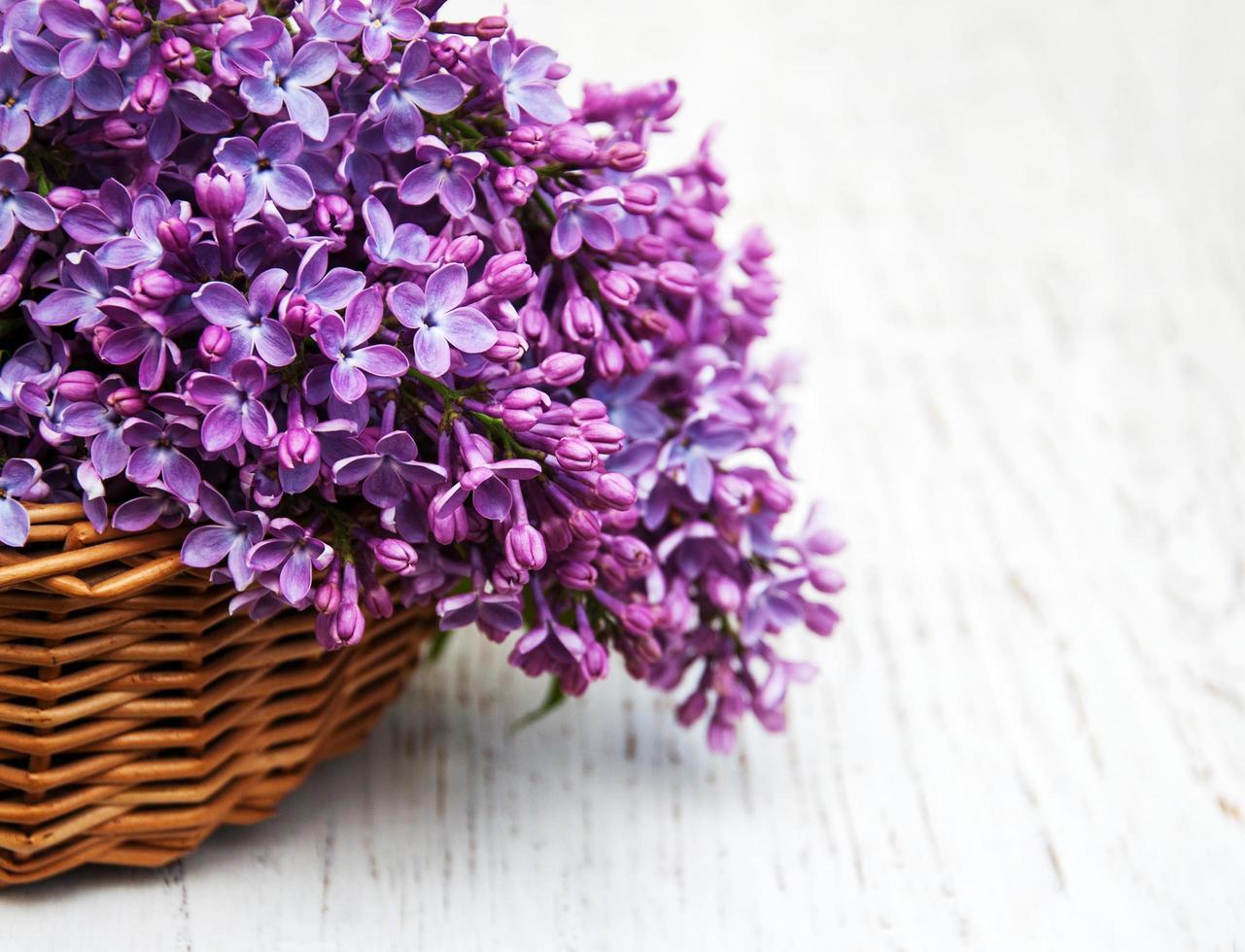 Lilac flowers on table photo