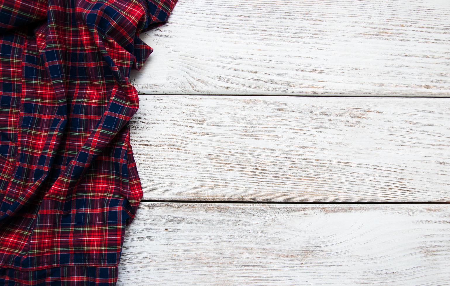 Checkered napkin on a wooden background photo