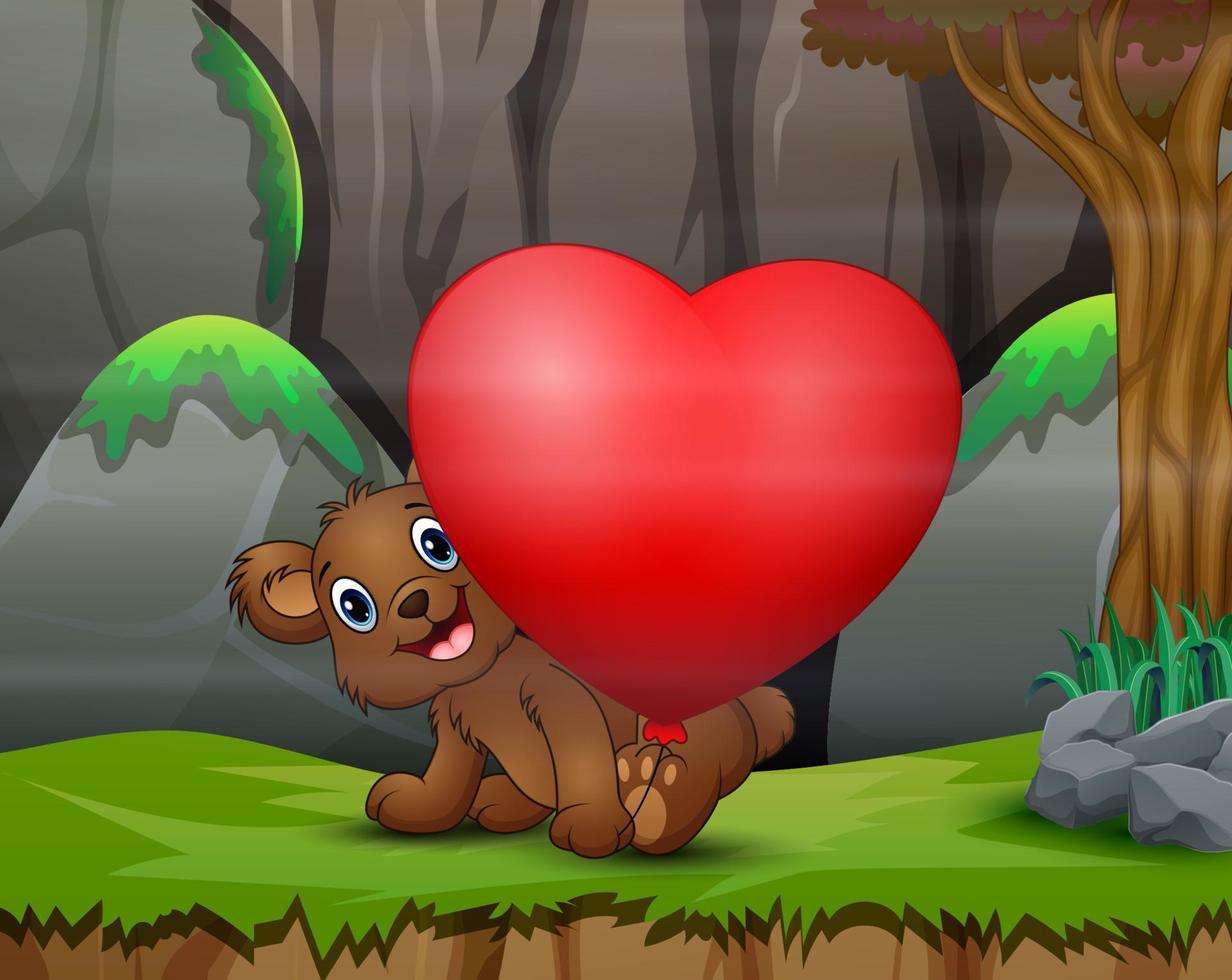 oso bebé feliz con globo de corazón rojo en la naturaleza vector
