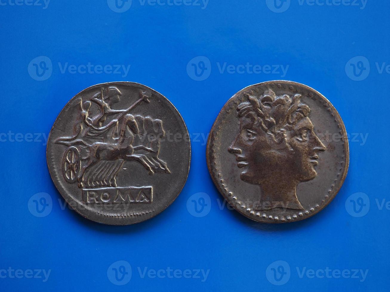 vintage Roman coin over blue photo