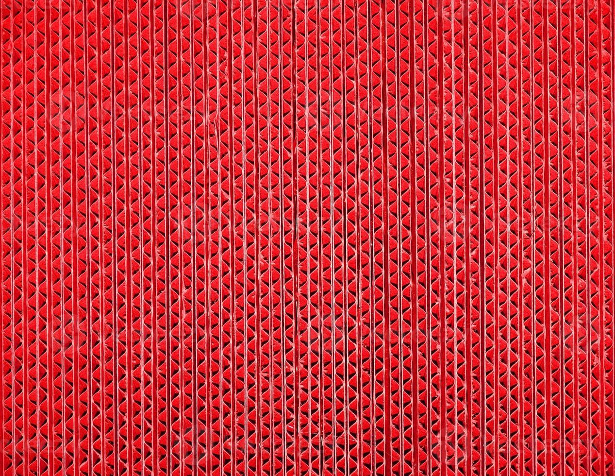 red corrugated cardboard texture background photo