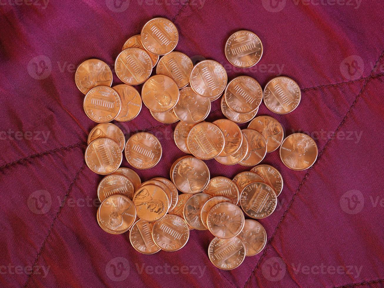 One Cent Dollar coins, United States over red velvet photo