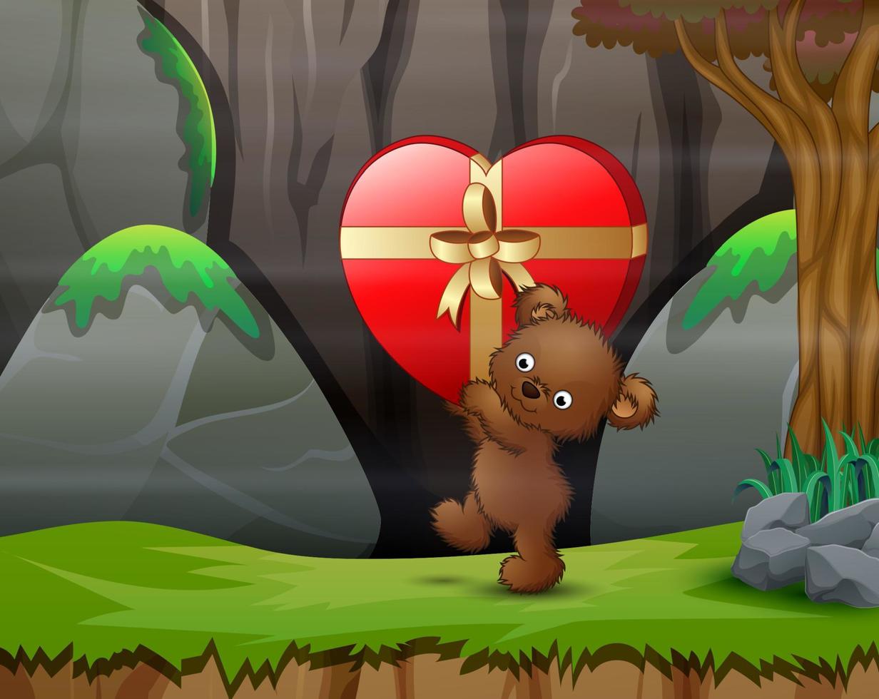 oso de peluche que lleva un gran regalo de corazón rojo en la naturaleza vector