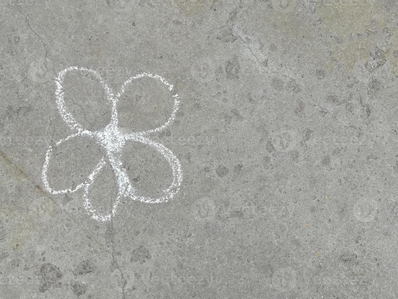 flower is drawn with chalk on the asphalt. summer. banner place for text, children, creativity, copy space photo