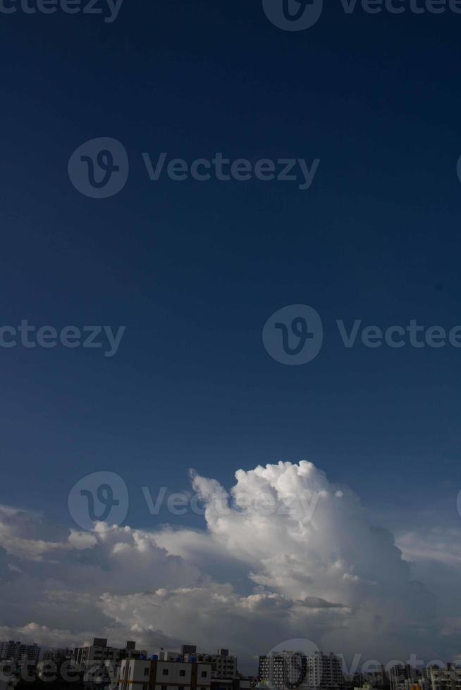 Air clouds in the blue sky photo