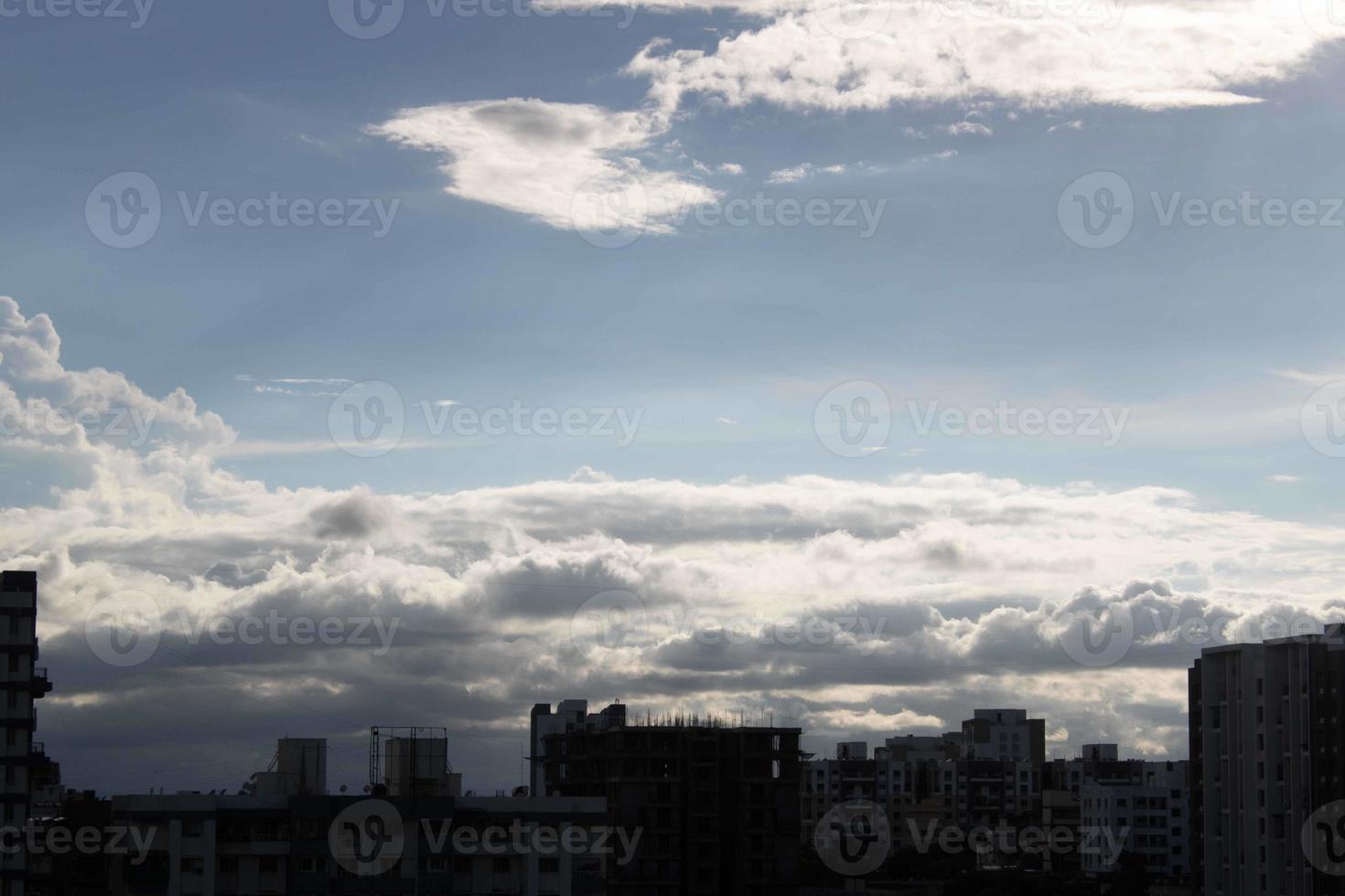 Air clouds in the blue sky photo