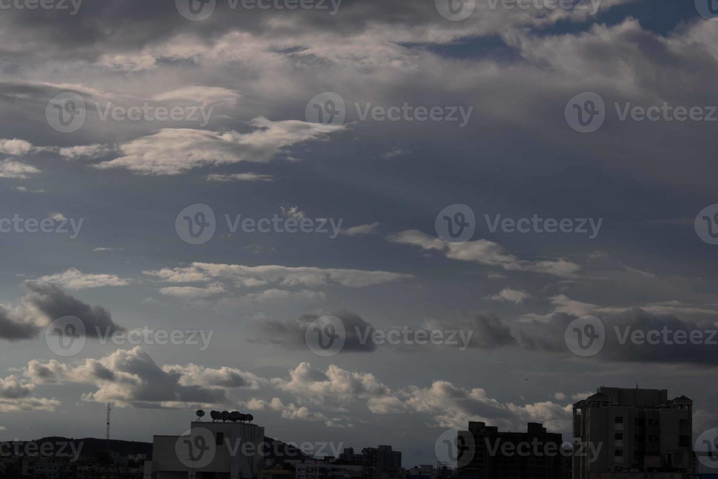 Air clouds in the blue sky photo