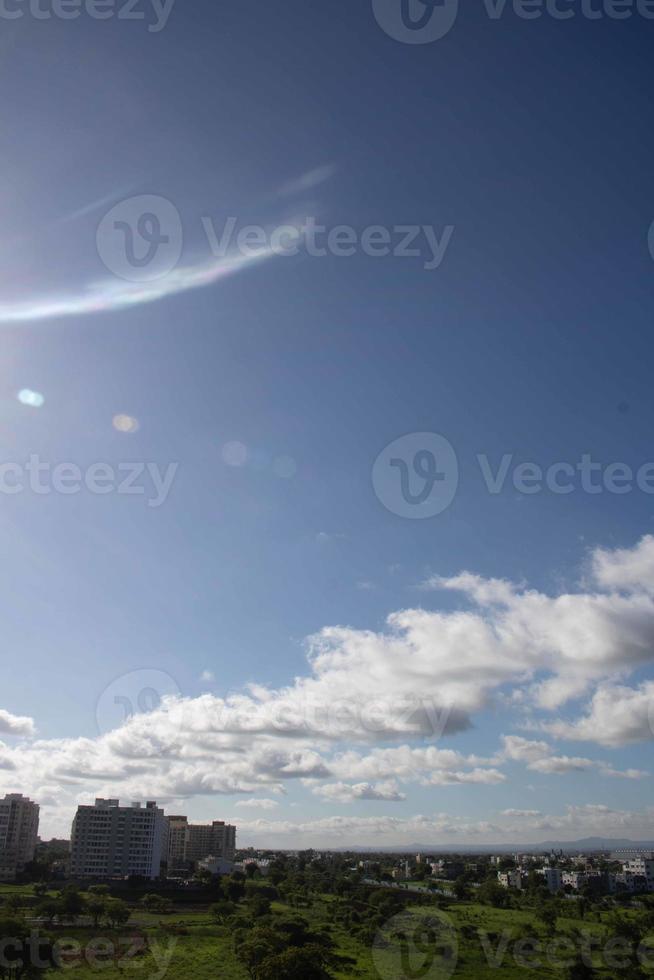 Air clouds in the blue sky photo