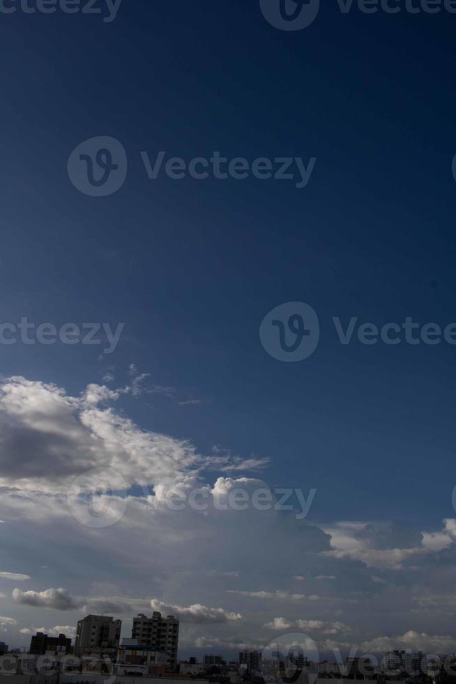 Air clouds in the blue sky photo