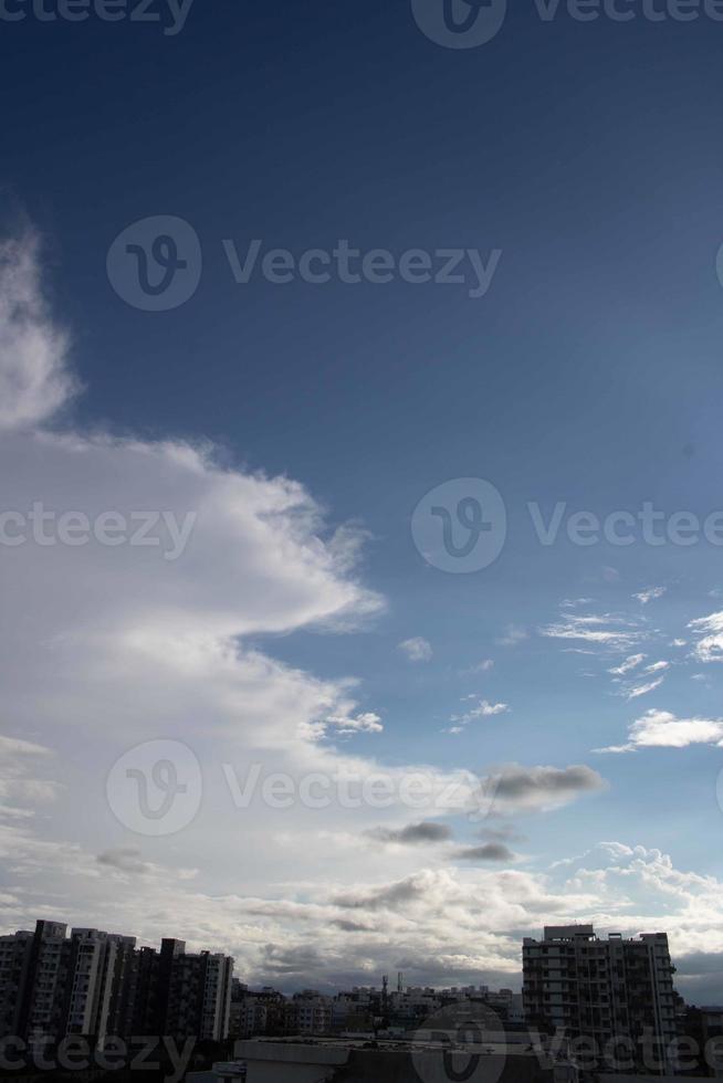 Air clouds in the blue sky photo