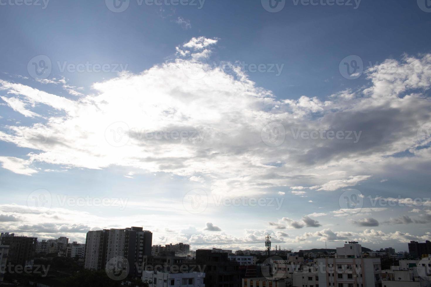 Air clouds in the blue sky photo