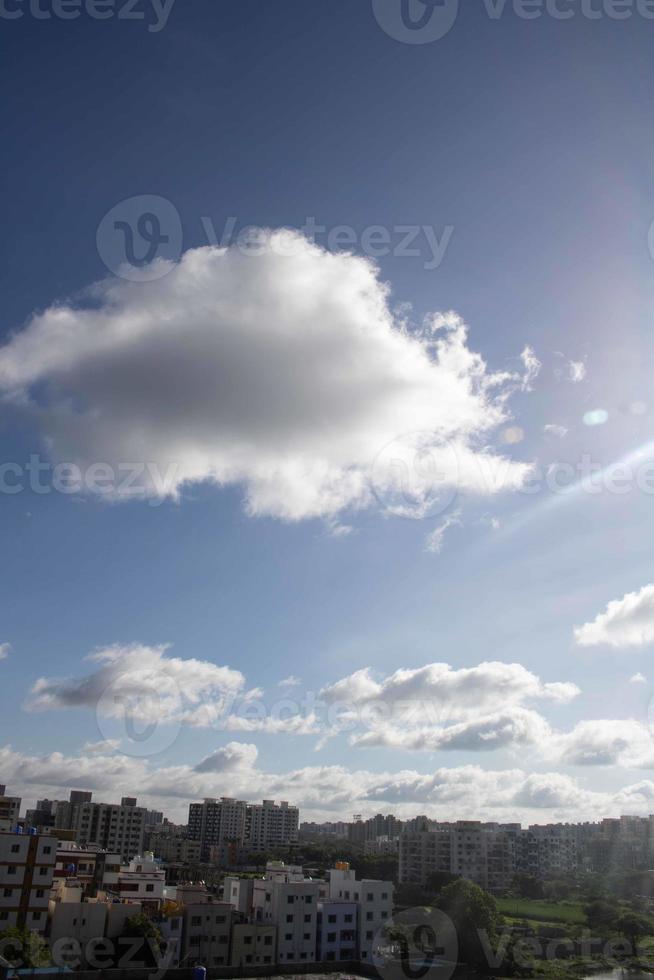 Air clouds in the blue sky photo