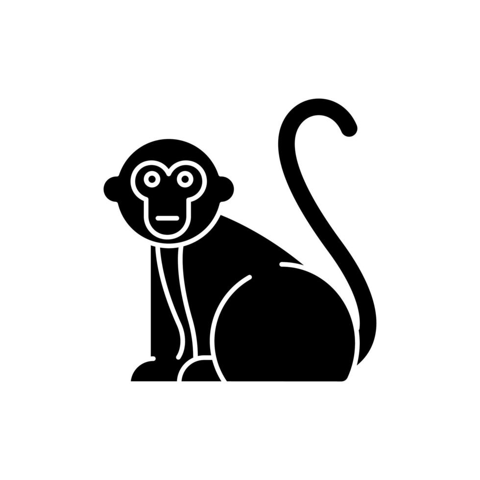 Monkey glyph icon. Tropical country animals, mammals. Trip to Indonesia zoo. Exploring exotic wildlife. Primate sitting. Silhouette symbol. Negative space. Vector isolated illustration