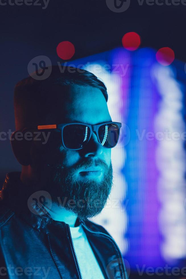 portrait of young bearded man in sunglasses photo