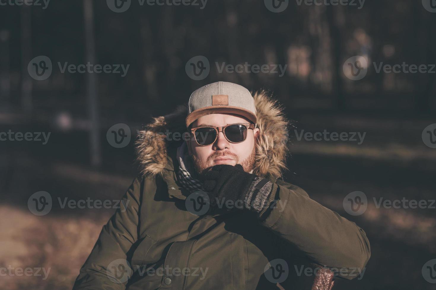 bearded man in a winter jacket photo