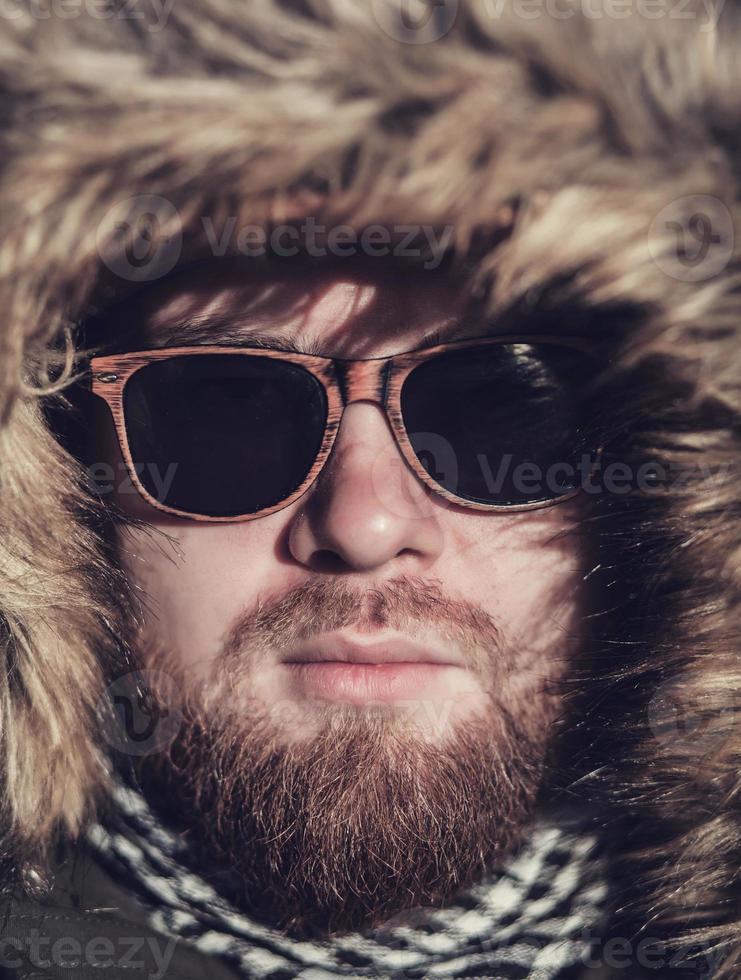 bearded man in sunglasses photo