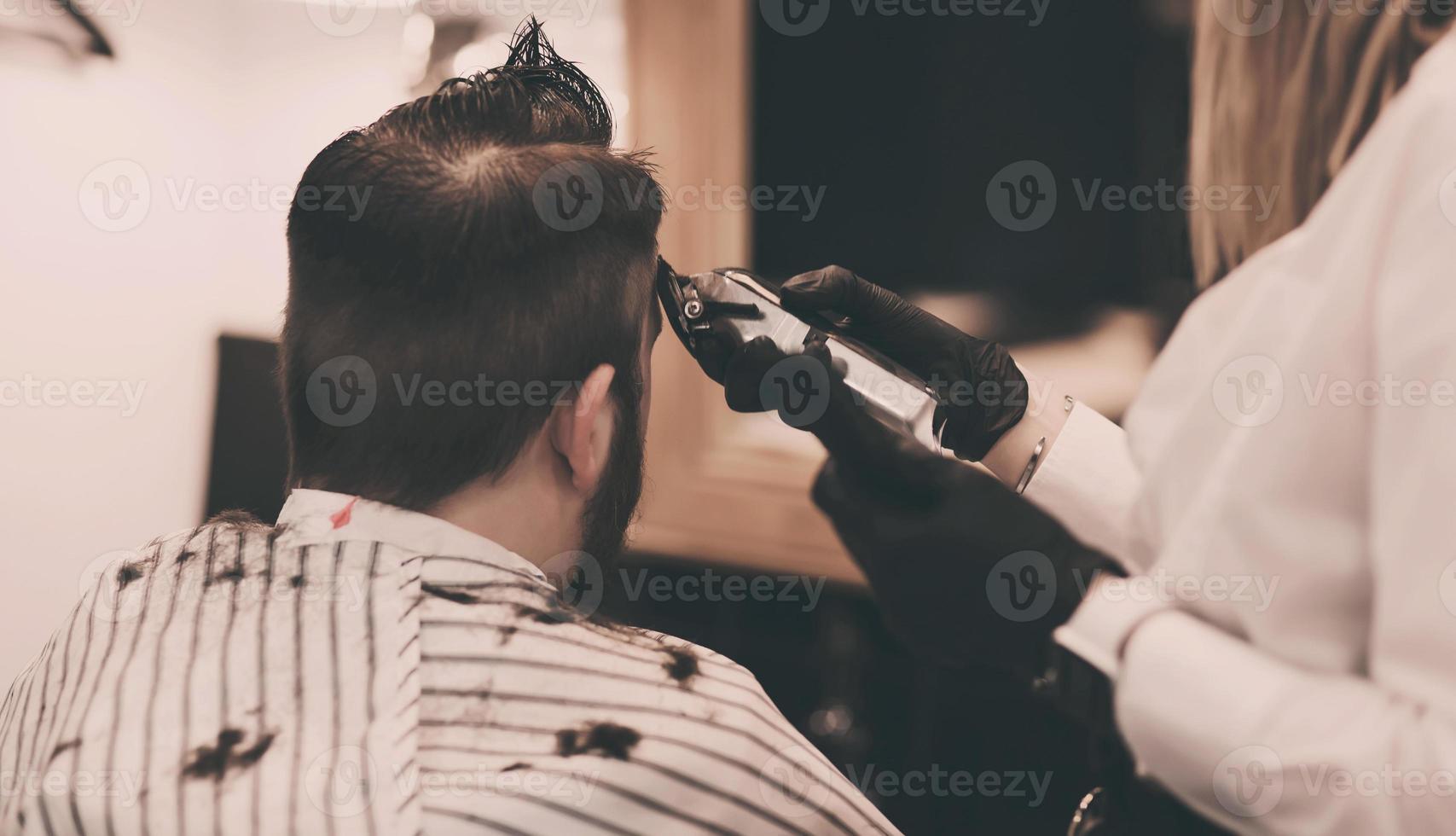 Portrait of man in barbershop. photo