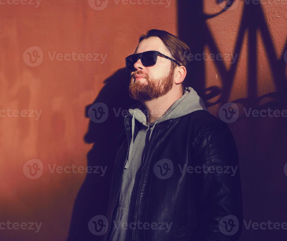 stylish bearded man in a leather jacket photo