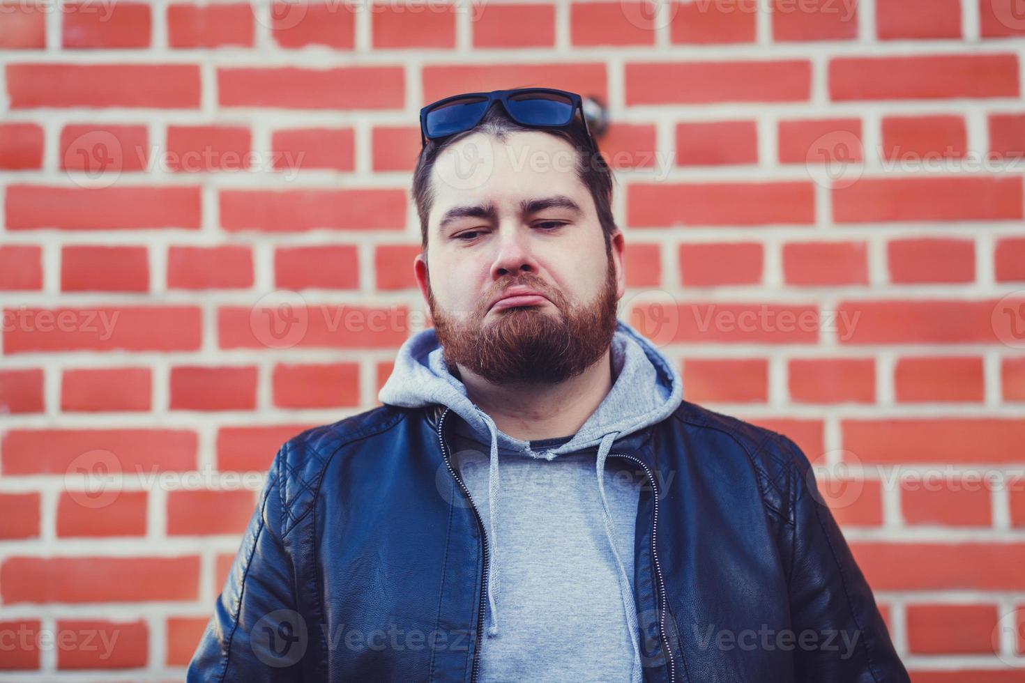 portrait of a sad man in a leather jacket photo