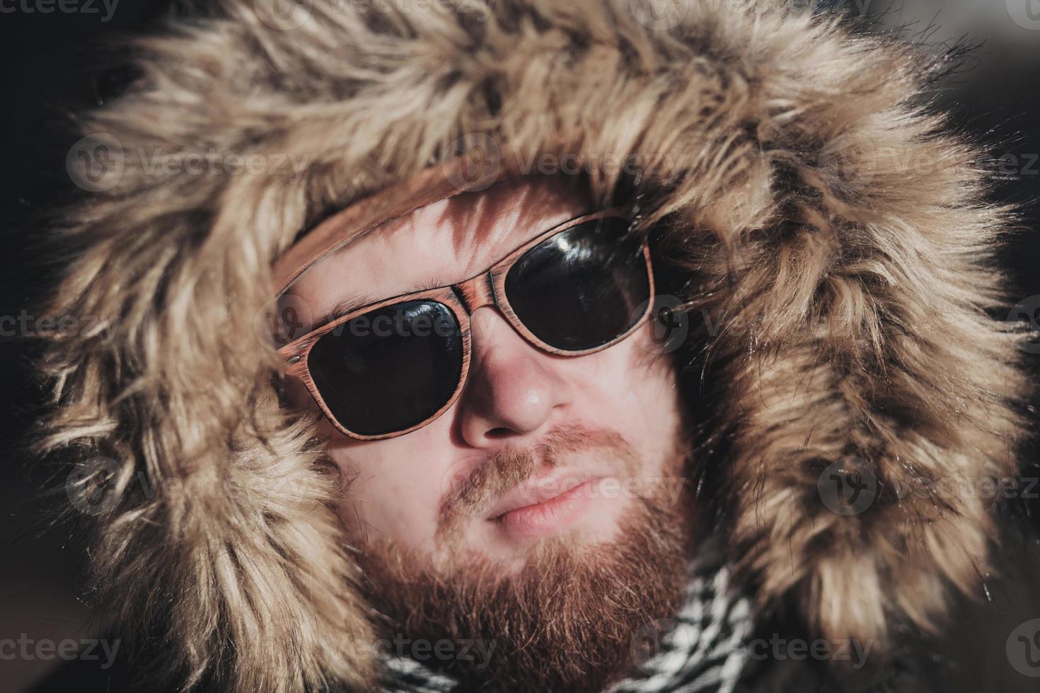 brutall face of a man with a beard stubble photo