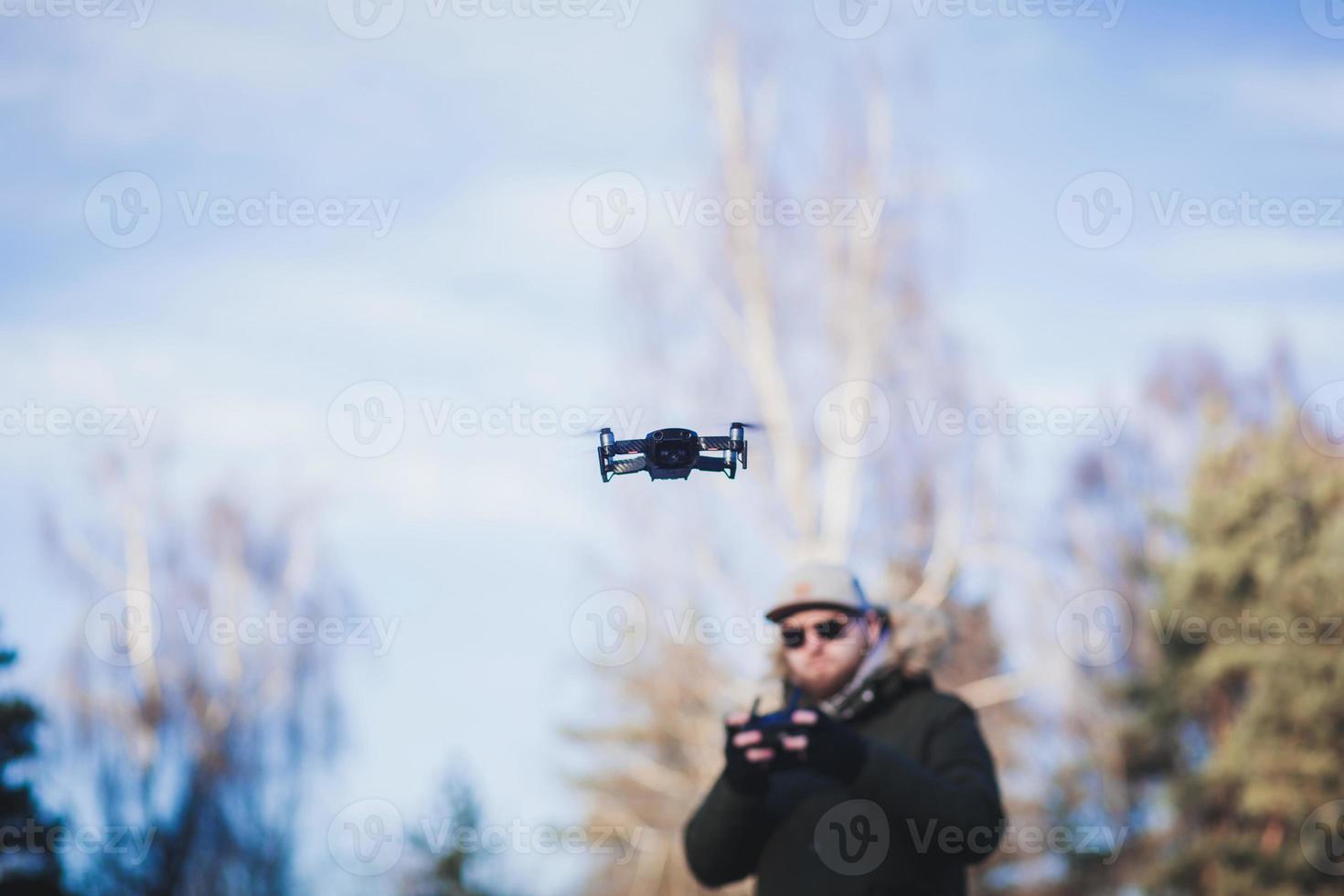 Man controls a copter photo