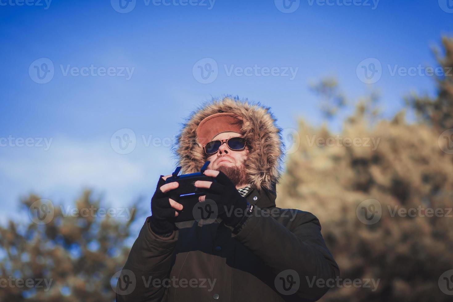 man in sunglasses with a remote control photo