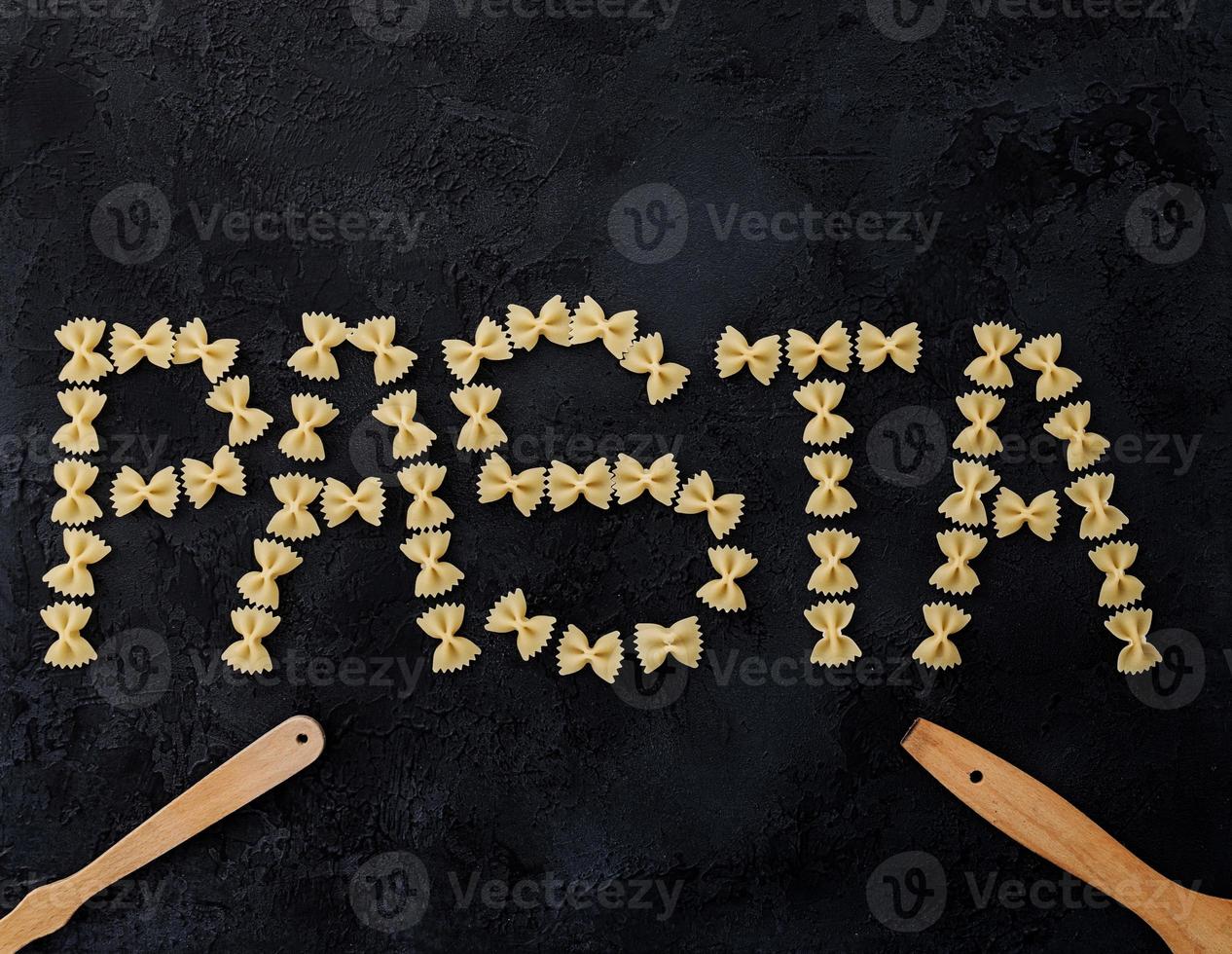 word pasta on a dark background photo
