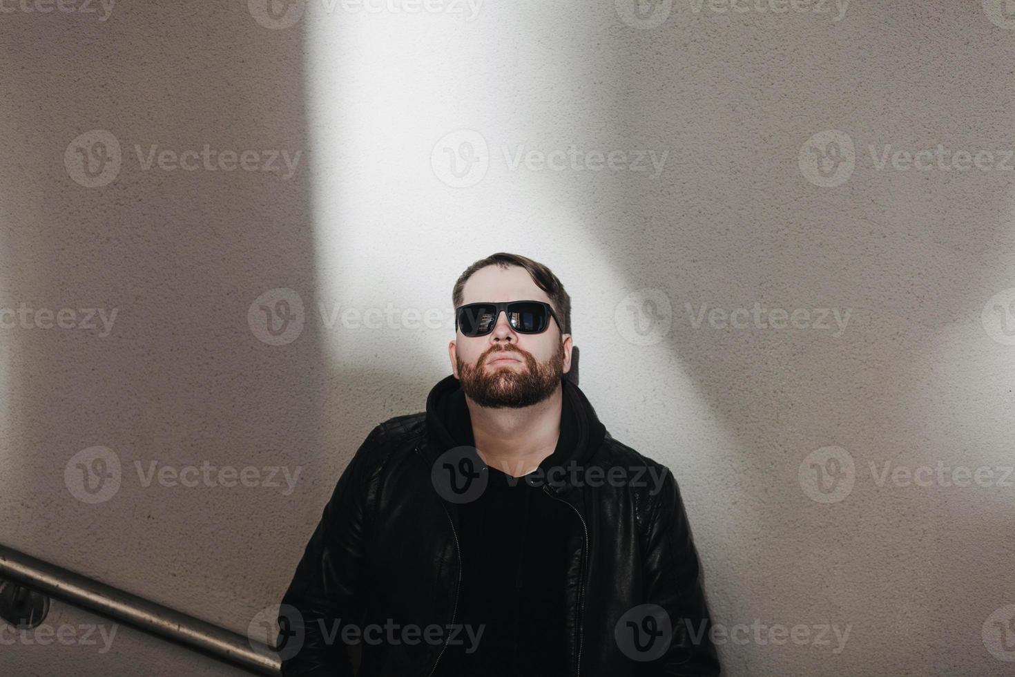 bearded man in leather jacket photo