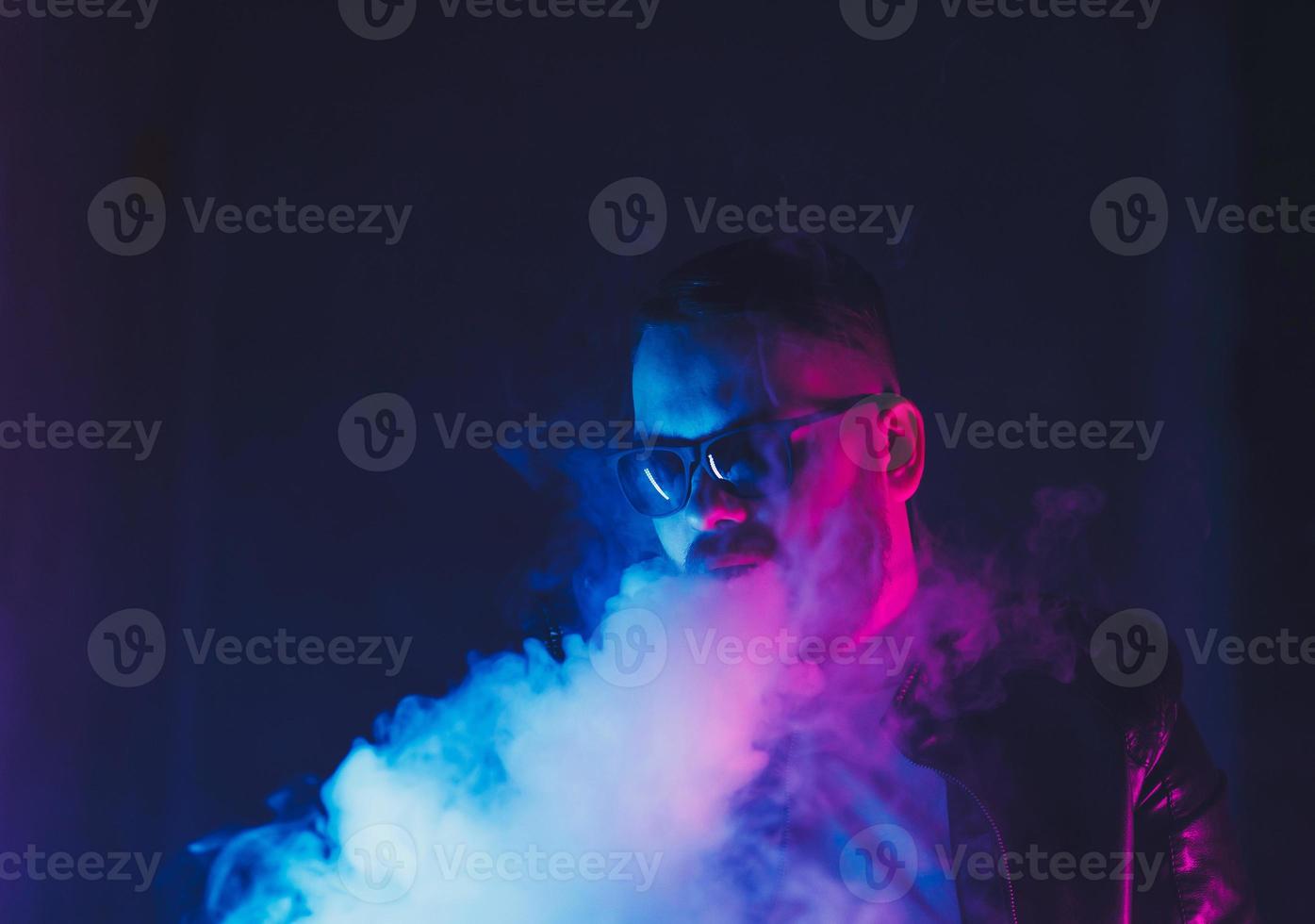 bearded man smoking vape photo