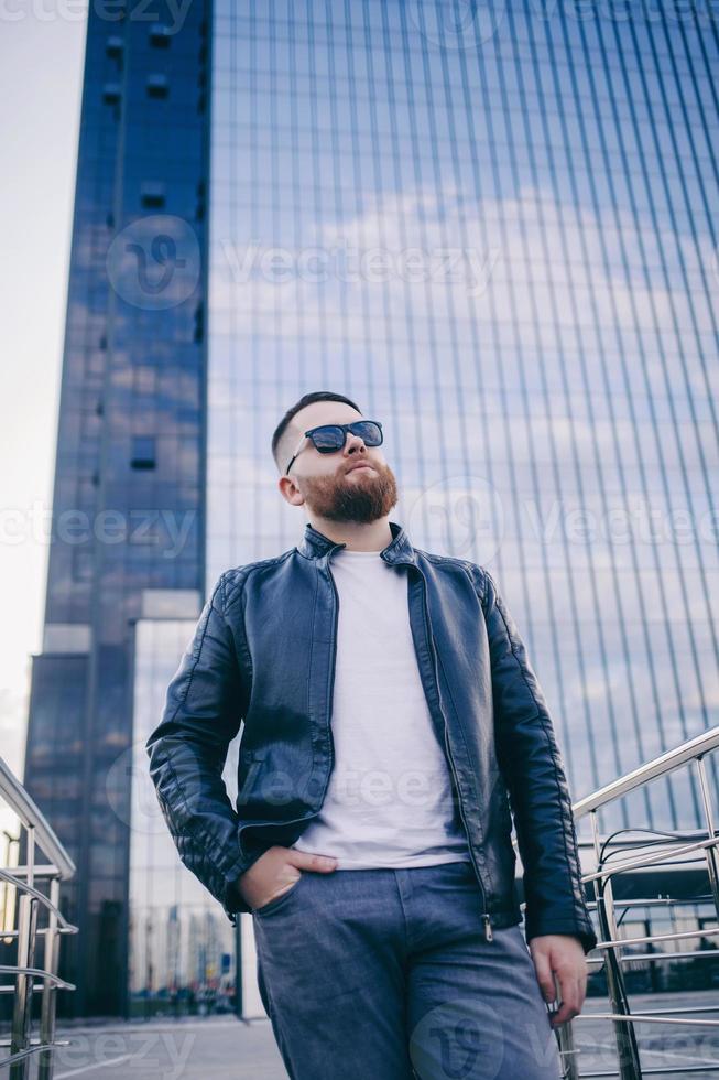 Confident man wearing leather jacket photo