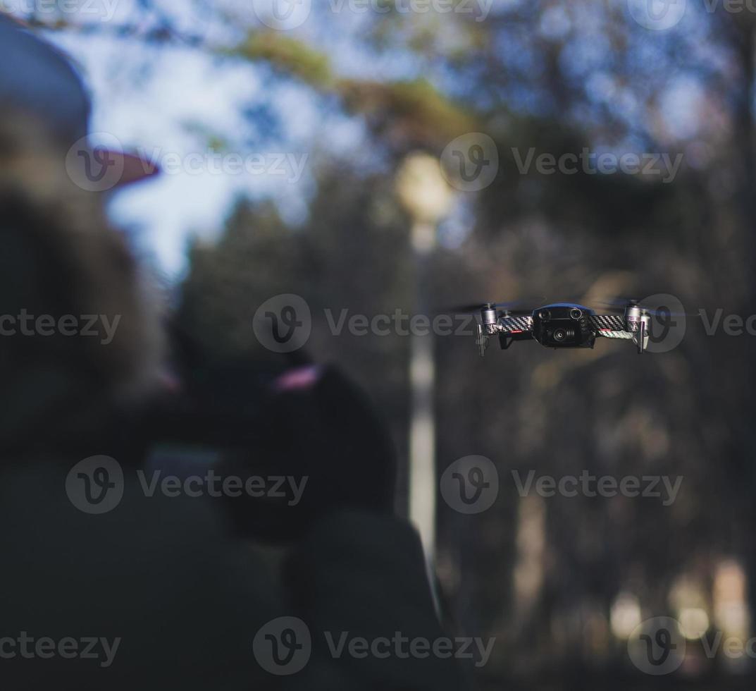 Male holding a drone remote control photo