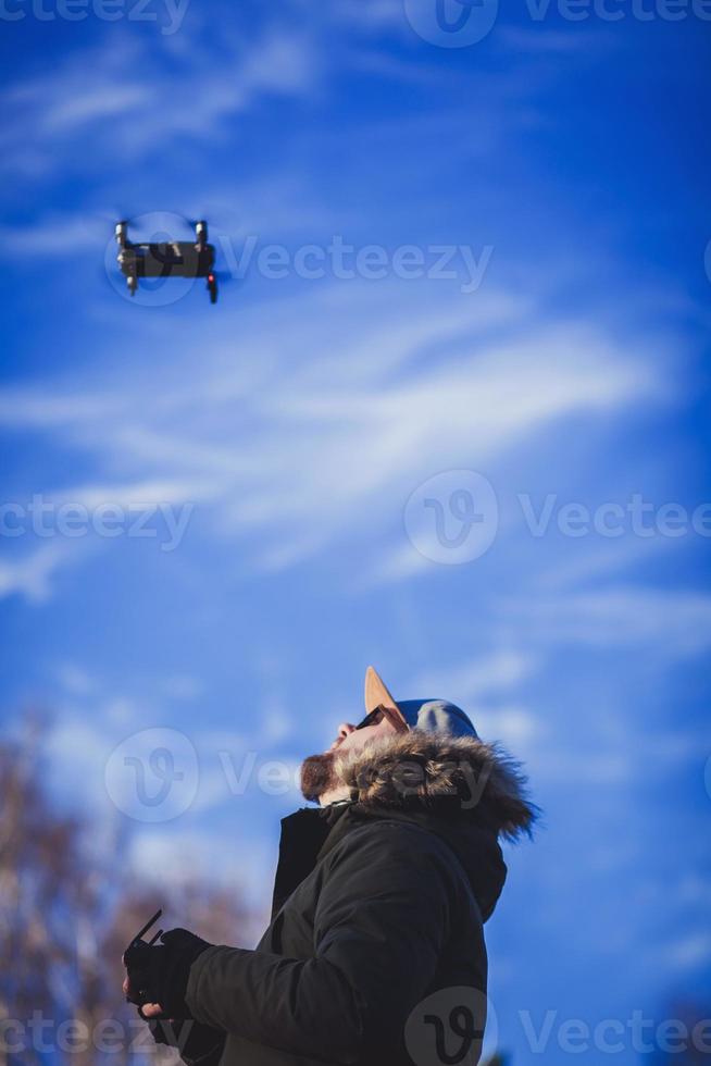man playing with the drone photo