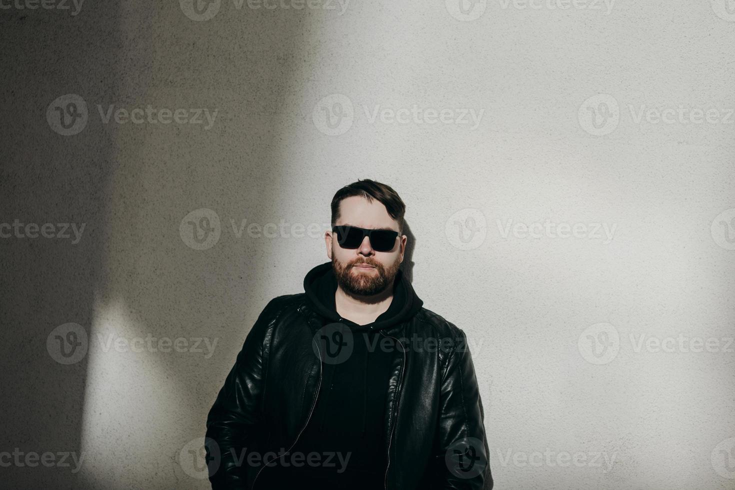 bearded man in leather jacket photo