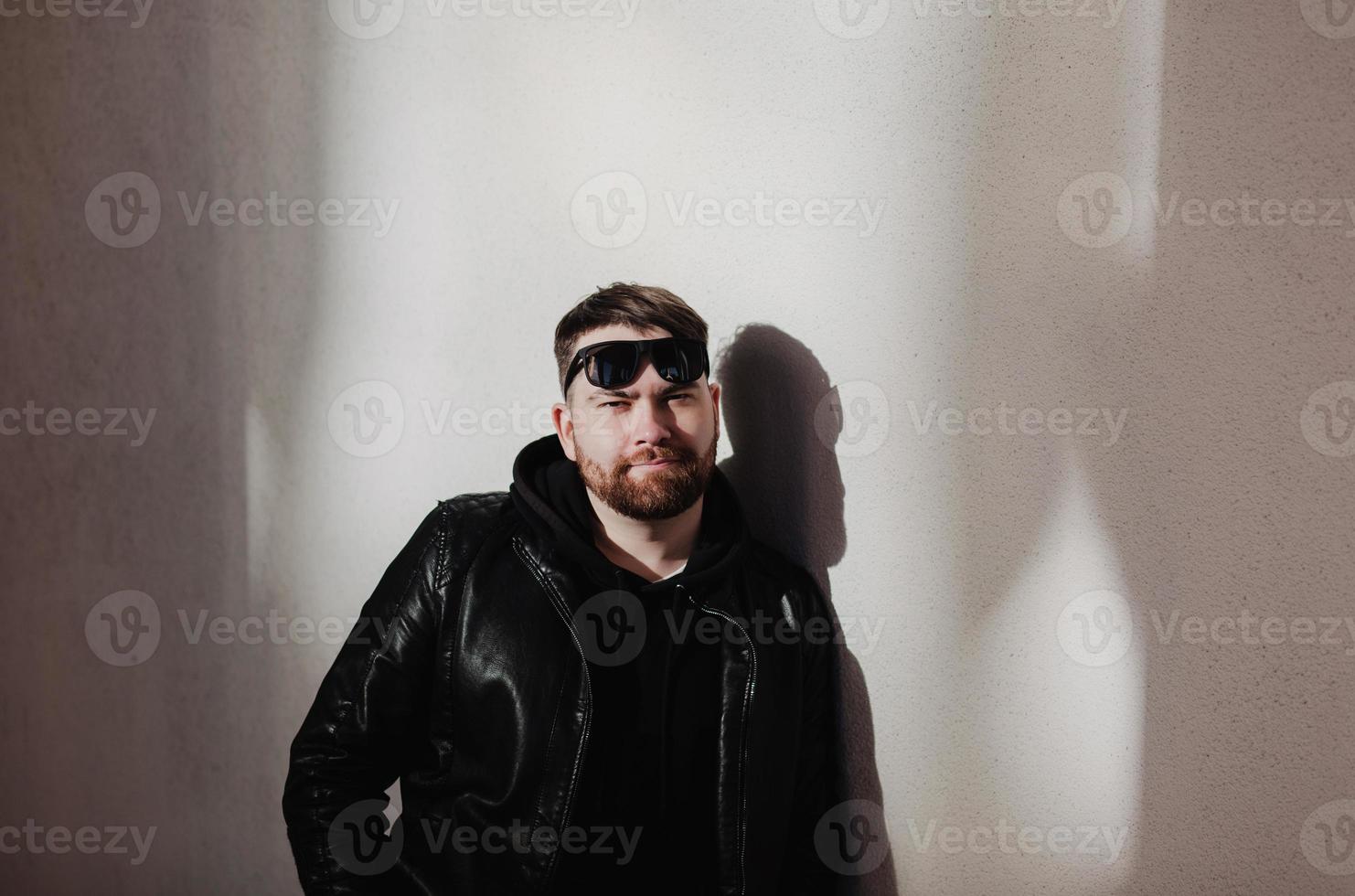 trendy man in black leather jacket photo