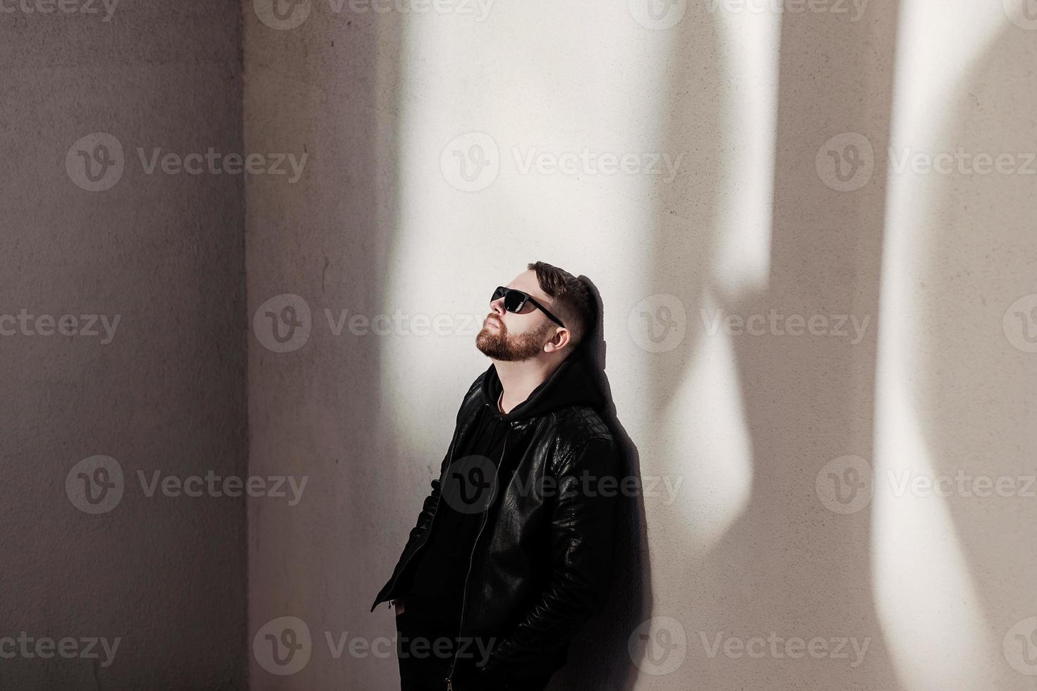 Fashion bearded man in leather jacket photo