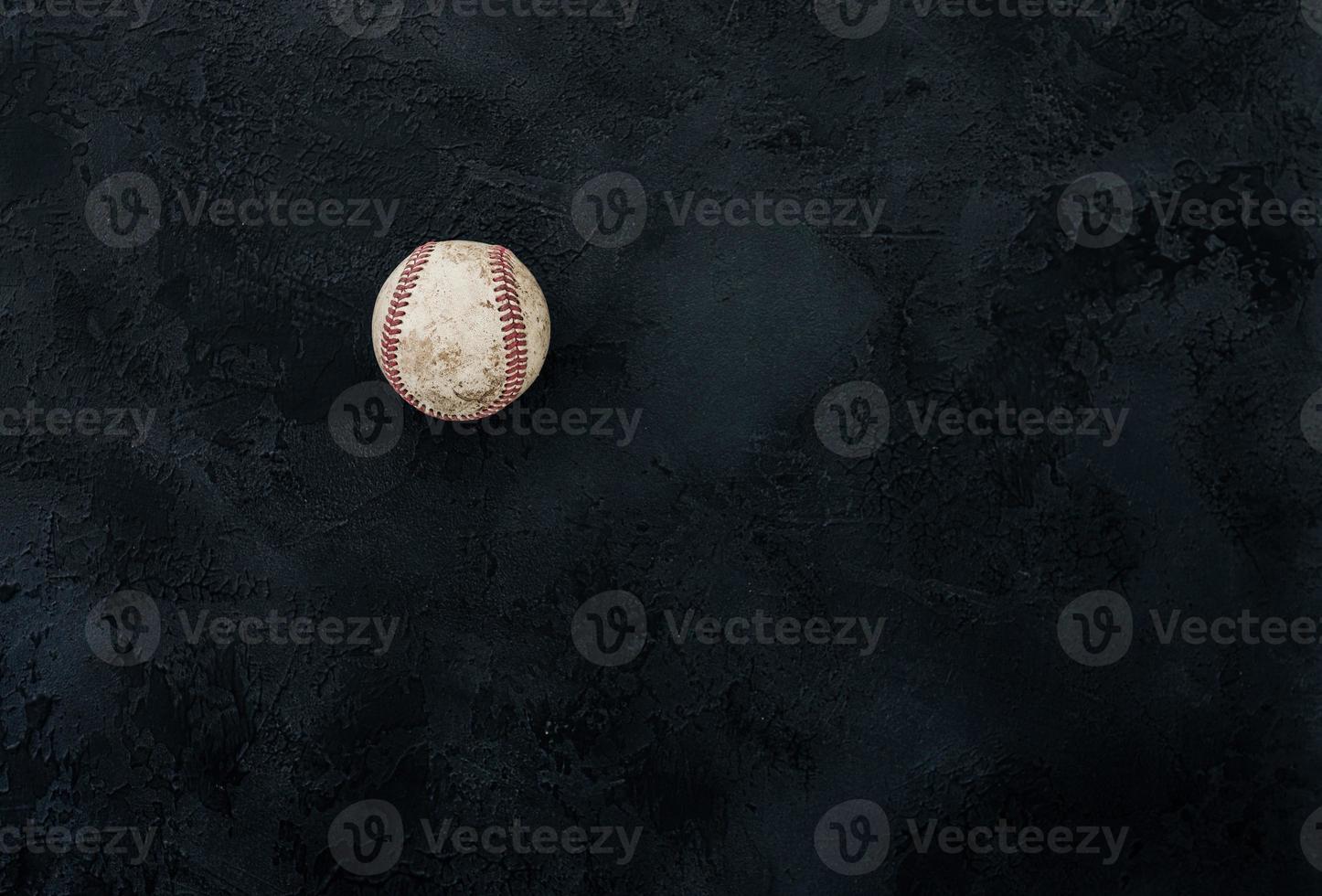 Baseball ball on a black background photo