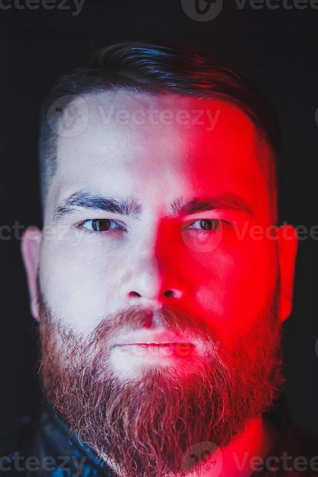 Bearded man in colorful lights photo