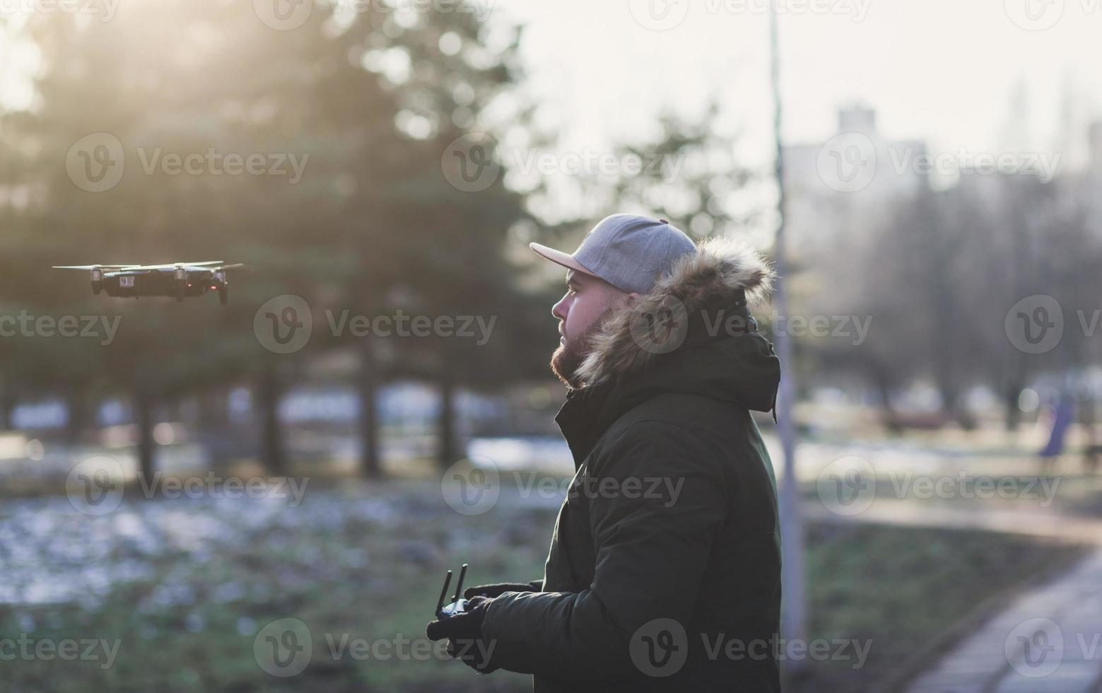 Man operating a drone photo