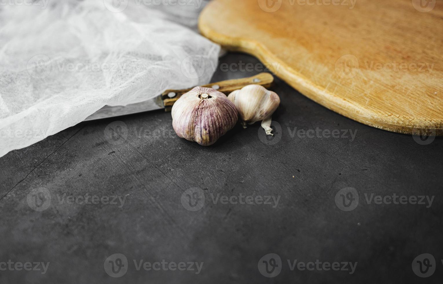 Garlic bulbs on table. photo