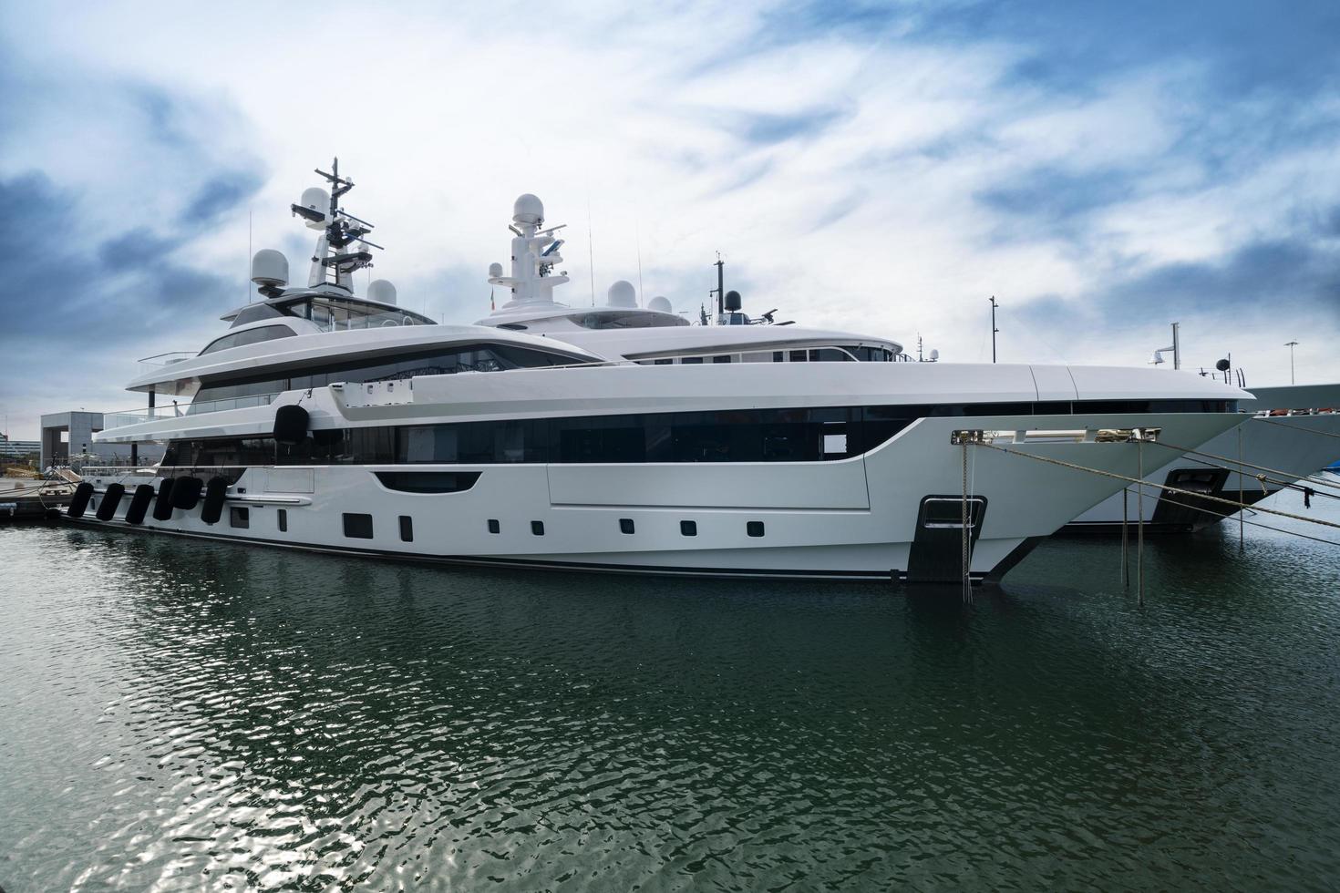 Luxury yachts anchored in a marina on a cloudy day Viareggio Lucca  13 Febrruary 2022 photo