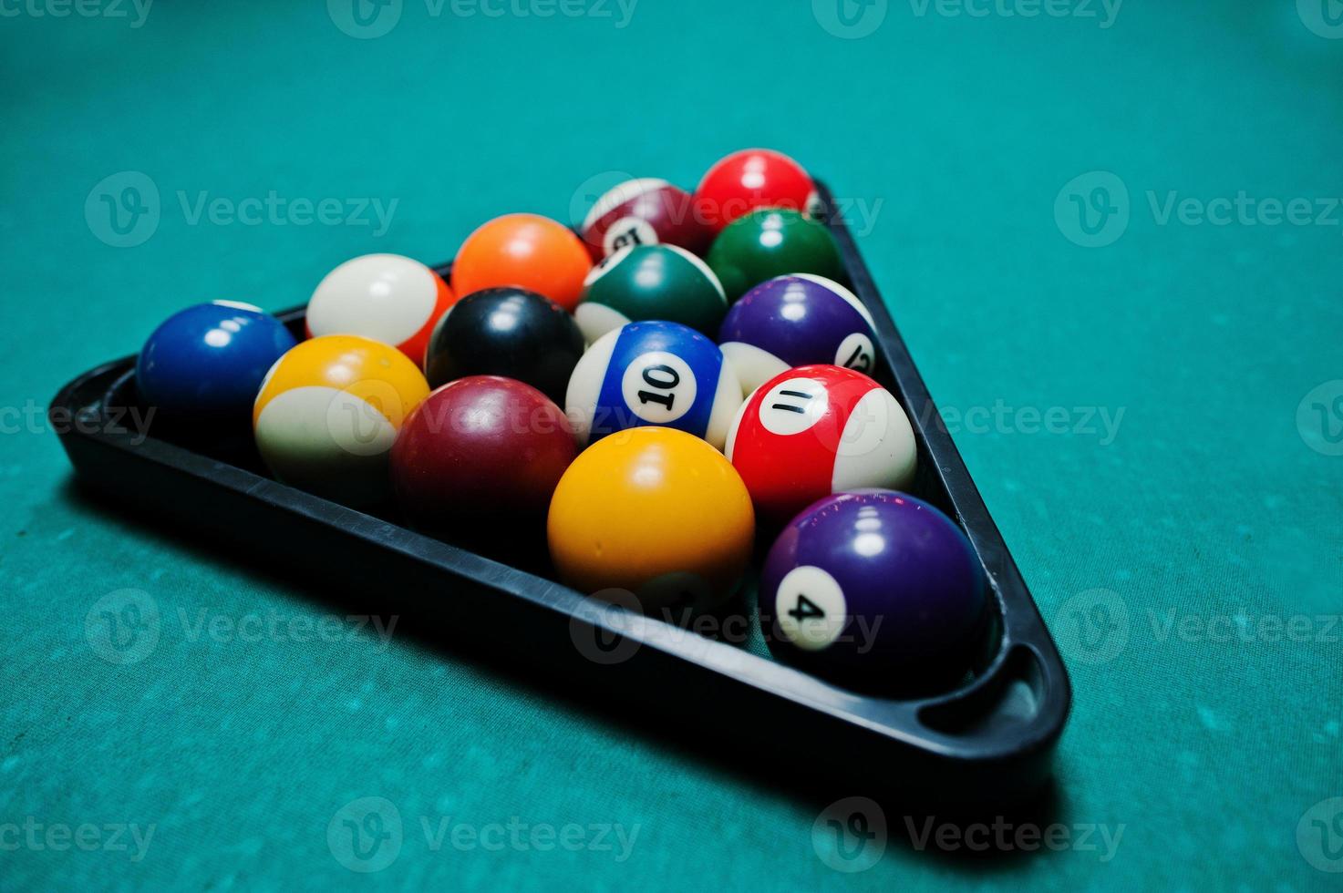 Billiard balls in a pool table at triangle photo