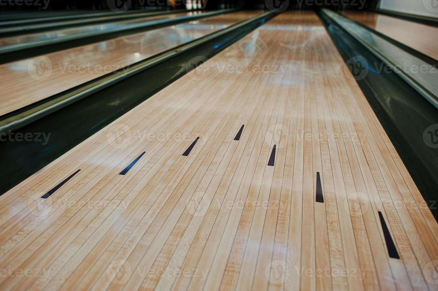 Bowling wooden floor with lane photo
