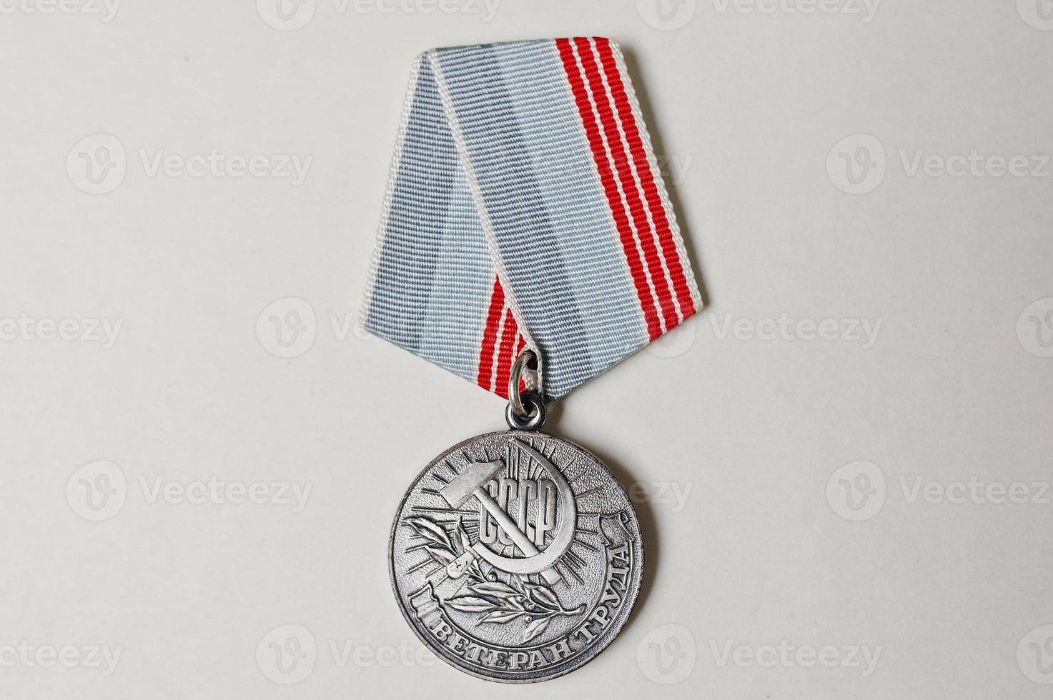 Soviet medal for labor veteran on white background photo