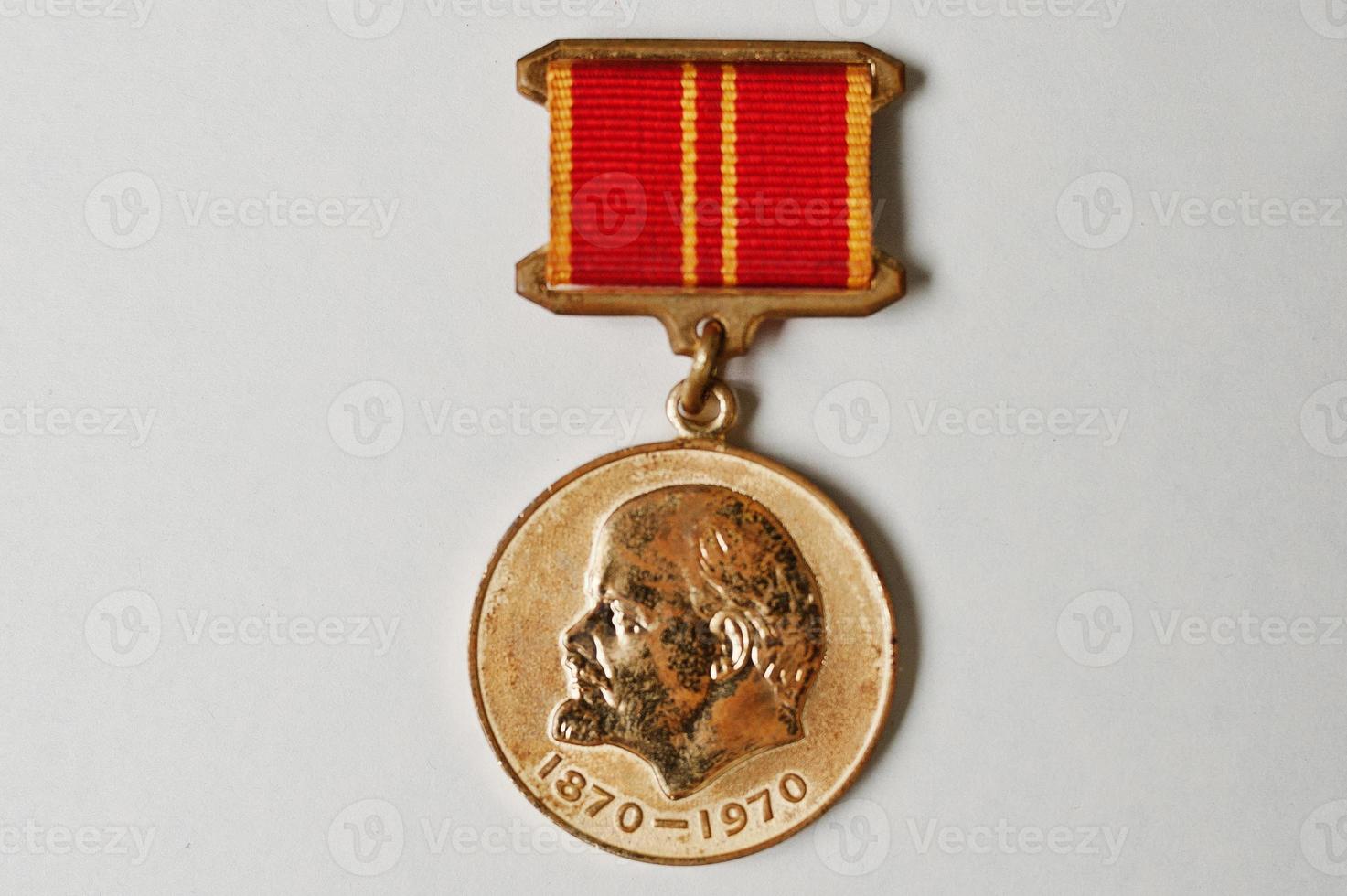Soviet medal for the valiant work 100 anniversary of Lenin's birth on white background photo